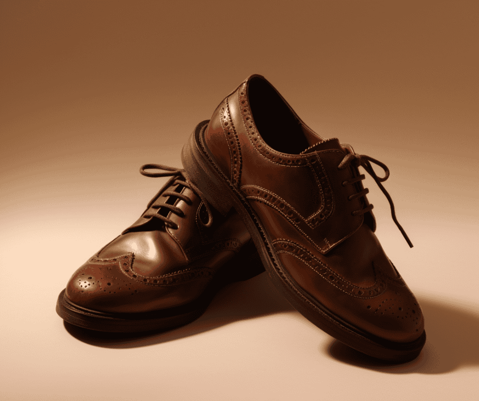 Close-up of classic brown leather shoes positioned together, representing the idea of honoring commitments—even when they’re uncomfortable to carry.