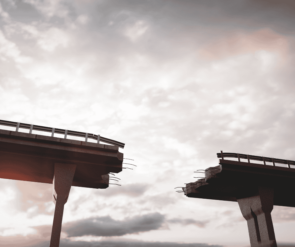 A broken bridge with a visible gap between two sections, symbolizing the space that appears after something is finished and before what comes next begins.