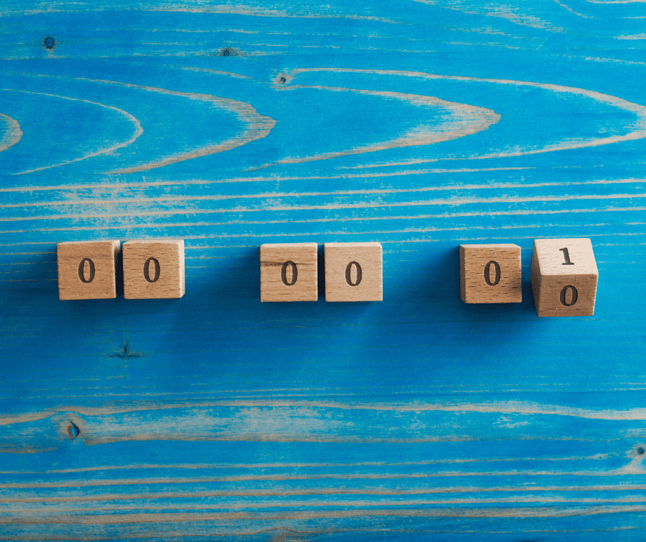 Wooden counter blocks on a blue background ticking down toward zero, representing the chase for inbox zero