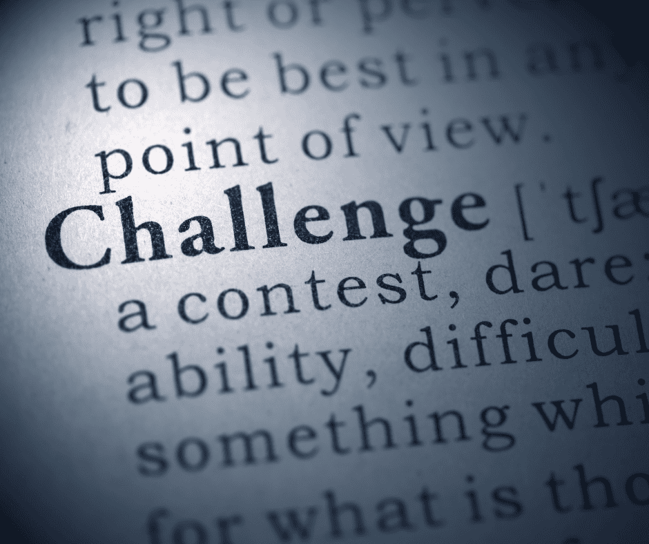 A dictionary page in close-up showing the entry for "challenge," framing what makes a personal challenge worth taking on