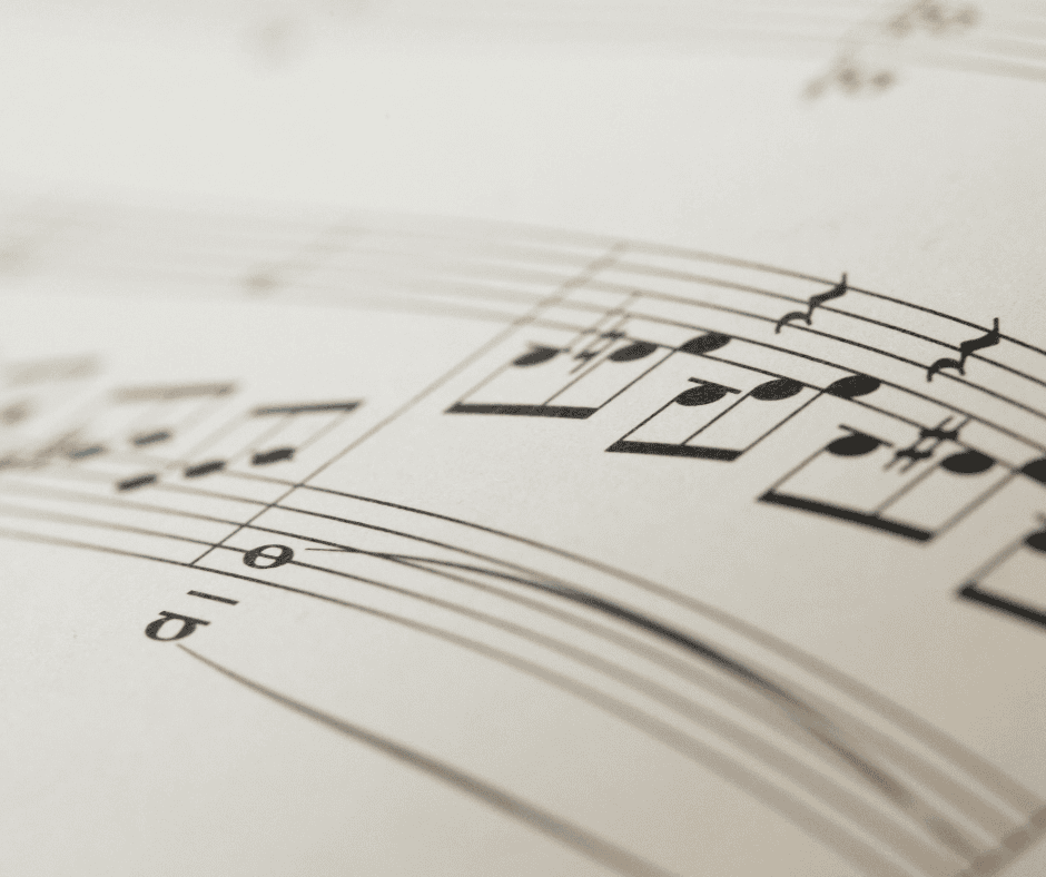Sheet music in close-up showing notes and rests across the staff, illustrating the difference between consistency vs cadence