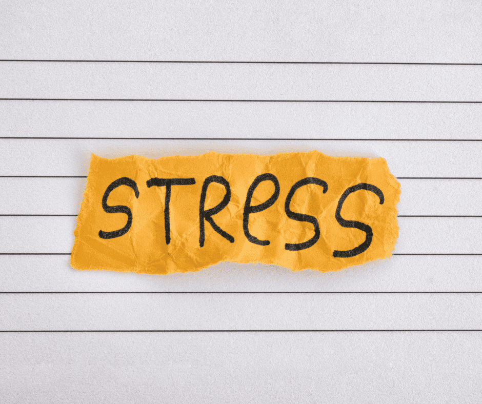 A torn strip of yellow paper with "stress" handwritten on it, representing the types of work stress worth naming